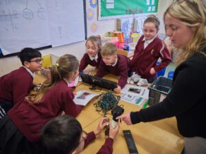 Schoolchildren learning about electrical recycling